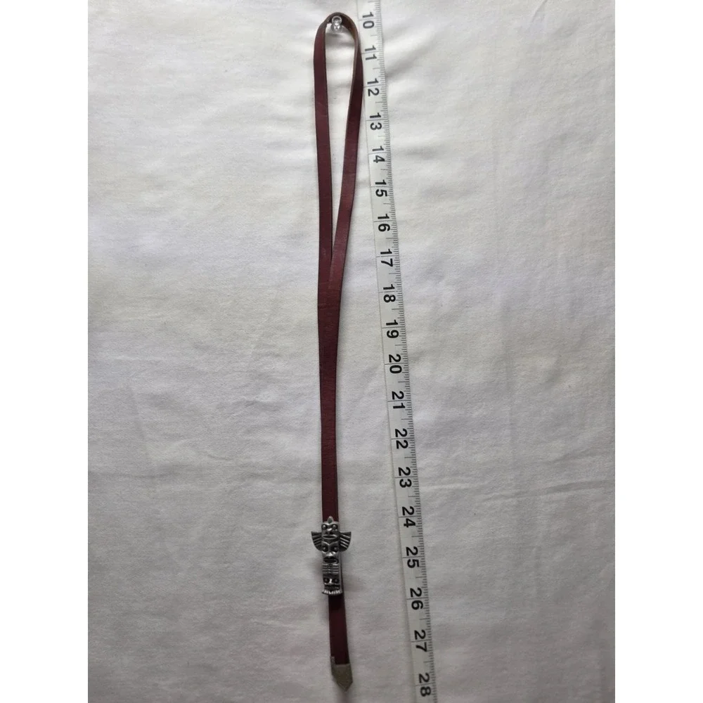 Vintage Canadian Leather Bolo Tie‎ with Totem Design and Decorative Metal Tips